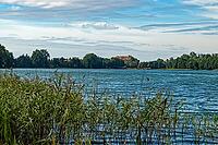 View across Lake Olow to Ryn Castle in Ryn in Poland [IBR125363605]