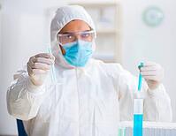 The young chemist works in a chemical laboratory [IBR125363606]