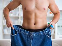 The man in oversized pants in the weight loss concept [IBR125382576]