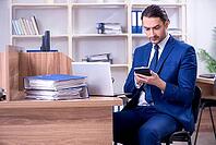 Young handsome businessman working in office [IBR125382580]