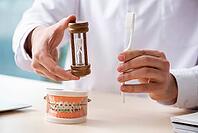 Male doctor, stomatologist working in clinic [IBR125382584]