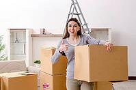 Young beautiful woman moves into a new apartment [IBR125382587]