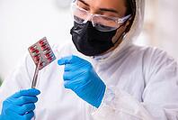 Experienced criminologist works in evidence laboratory [IBR125382598]