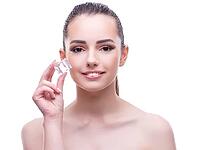 The woman in the beauty concept puts on makeup [IBR125382599]