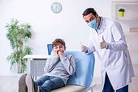 The boy visits doctor in hospital [IBR125382603]