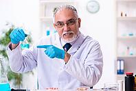 Old chemist working in laboratory [IBR125382610]