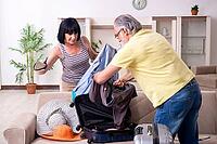 The old couple is preparing for vacation trips [IBR125382615]