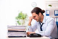 Young employee dissatisfied with excessive work [IBR125382623]