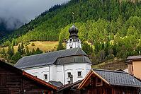 View of the parish church of the Nativity of Mary in Reckingen, Switzerland [IBR125382632]