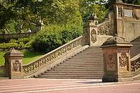 Wide stone staircase surrounded by greenery, curved steps lead to the terrace, richly decorated New York [IBR125382635]