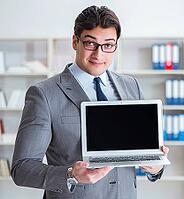 The young businessman works in the office [IBR125382652]
