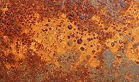 Flat rust texture on iron surface, natural oxidation pattern with orange and brown tones. AI generated [IBR125395920]