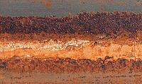 Flat rust texture on iron surface, natural oxidation pattern with orange and brown tones. AI generated [IBR125395925]