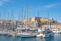 View of the historic fortifications of Fort Saint-Nicolas on the southern side of the port entrance to the Old Port, dominated by walls and green spaces opposite the city center, Marseille, Bouches-du-Rhone, Provence, Provence-Alpes-Cote d'Azur, France [IBR125405017]