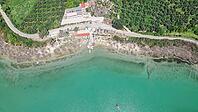 Lake Kournas in Crete aerial view of pedal boat rental clear water and scenic Greek nature on a sunny day [IBR125405047]