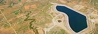 Reservoir in Omalos village in the western part of Crete, mountain water storage surrounded by Mediterranean nature and beautiful landscape [IBR125405048]