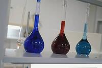 Test tubes and flasks with multi-colored liquids in the laboratory. Chemical reagents in the laboratory [IBR125405050]
