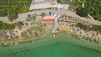 Lake Kournas in Crete aerial view of pedal boat rental clear water and scenic Greek nature on a sunny day [IBR125405055]