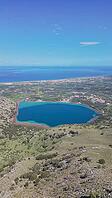 Aerial view of Lake Kournas in Crete and Cretan Sea, panoramic landscape of Greek island nature and mountain horizon [IBR125405070]