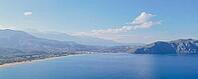Paradise Greek island Crete from drone panoramic view in clear weather, showcasing coastline, villages and natural Mediterranean beauty in bright daylight [IBR125405076]