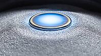 Close-up of an intense blue-white molten stainless steel weld pool on a bed of fine silvery steel powder, peak fusion temperature, industrial macro photography, additive manufacturing, AI generated [IBR125407437]