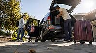 Family packing a car with luggage on a sunny autumn morning, preparing for travel. Vacation, AI generated [IBR125407450]