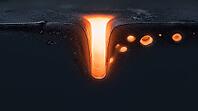Abstract cross-section visualization of a glowing keyhole vapor depression cavity with trapped porosity voids in molten metal, dark background, additive manufacturing defect science, AI generated [IBR125407451]