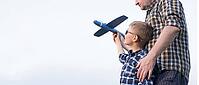 Dad and son have fun in the field and play with an airplane. Father's Day concept [IBR125411068]