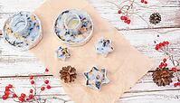 We make our own bird food in foil molds from bacon and seeds. Winter birdhouses on a white wooden background. View from above [IBR125411108]