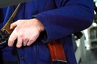 A security guard's hand on a Kalashnikov. Armed departmental guards [IBR125411129]