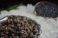 Black caviar served on the table. Exquisite delicacy of black sturgeon caviar [IBR125411141]