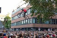 05 September 2026, Mountain bike riders jump over a crowd during the Red Bull Cerro Abajo urban downhill event in Stuttgart, Germany [IBR113394905]