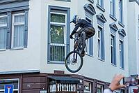 05 September 2026, a mountain biker leaps through the air during the Red Bull Stuttgart Cerro Abajo urban downhill race in Stuttgart, Germany [IBR113394908]