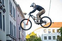 05 September 2026, a mountain biker leaps through the air during the Red Bull Stuttgart Cerro Abajo urban downhill race in Stuttgart, Germany [IBR113394910]