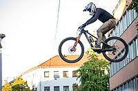 05 September 2026, a mountain biker leaps through the air during the Red Bull Stuttgart Cerro Abajo urban downhill race in Stuttgart, Germany [IBR113394915]