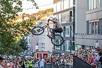 05 September 2026, A rider jumps mid-air during the Red Bull Cerro Abajo urban downhill mountain bike race in Stuttgart, Germany [IBR113394920]