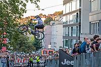 05 September 2026, A rider jumps mid-air during the Red Bull Cerro Abajo urban downhill mountain bike race in Stuttgart, Germany [IBR113394921]