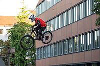 05 September 2026, Mountain bike riders jump over a crowd during the Red Bull Cerro Abajo urban downhill event in Stuttgart, Germany [IBR113394931]