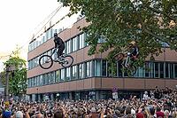 05 September 2026, Mountain bike riders jump over a crowd during the Red Bull Cerro Abajo urban downhill event in Stuttgart, Germany [IBR113394935]