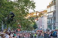 05 September 2026, A rider jumps mid-air during the Red Bull Cerro Abajo urban downhill mountain bike race in Stuttgart, Germany [IBR113394940]