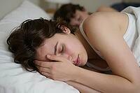 Restorative sleep patterns and circadian rhythm regulation in domestic bedroom environments, deep slumber promotes neurological regeneration and psychological recovery, subtle morning sunlight entering through windows touches tired facial features, physic [IBR125414119]