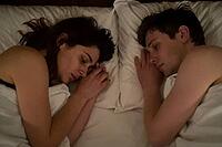 Emotional intimacy, nocturnal vulnerability, sleep psychology, young couple resting on pillows in bed, relationship dynamics, domestic silence, subtle facial expressions convey deep melancholy, emotional fatigue, psychological introspection during nightti [IBR125414207]