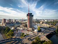 Aerial view of Elbtower construction site with construction cranes, Elbe bridges and intersection at Elbe bridges in front of Hamburg city skyline, Hamburg, Germany [IBR113394942]