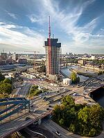 Aerial view of Elbtower construction site with construction cranes, Elbe bridges and intersection at Elbe bridges in front of Hamburg city skyline, Hamburg, Germany [IBR113394944]