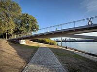 Entenwerder footbridge and cycle bridge (Entenwerder Bridge) over the Oberhafen Canal, with a riverside path along the Northern Elbe near Rothenburgsort, Hamburg, Germany [IBR113394946]