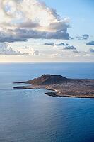 View of the sea and the island of La Graciosa with the Montaña Amarilla volcano, at sunset, Lanzarote, Canary Islands, Spain [IBR125414230]