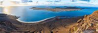 View of steep cliffs to sea and the island of La Graciosa, Mirador del Porrito viewpoint at sunset, Lanzarote, Canary Islands, Spain [IBR125414247]