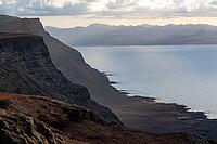 Steep cliffs on the coast with sea, Mirador del Porrito viewpoint at sunset, Lanzarote, Canary Islands, Spain [IBR125414261]