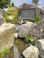 Source of the river Lenne Lennequelle on top of Kahler Asten in the Rothaargebirge with metal plate on it inscription Lennequelle 830 m above sea length of the river 138 km, Winterberg, Sauerland, North Rhine-Westphalia, Germany [IBR125414277]