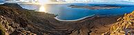View of steep cliffs to sea and the island of La Graciosa, Mirador del Porrito viewpoint at sunset, Lanzarote, Canary Islands, Spain [IBR125414287]